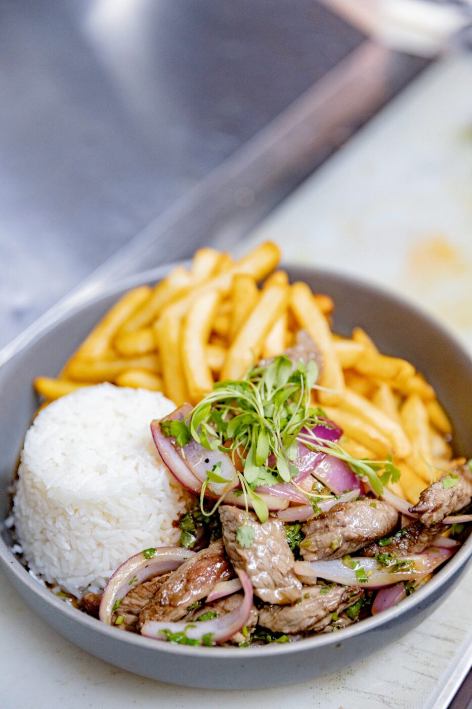 Lomo saltado with rice and fries